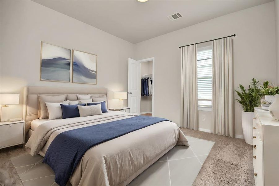 This bedroom offers warm sunlight from the large window. Imagine storing your belongings in the spacious closet, enjoying the breeze from a ceiling fan on warm days,  and relaxing in the ample space that easily accommodates a king-sized bed. This bedroom is ready to become your own personal haven.**This image is from another Saratoga Home with similar floor plan and finishes, not the Brittany floorplan.**