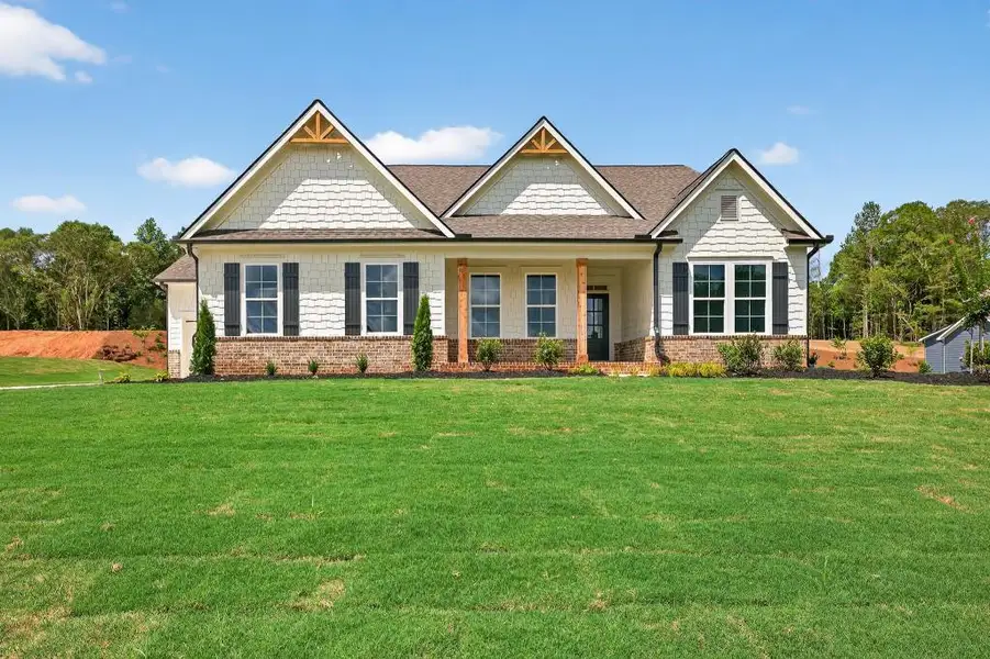Front exterior of a new home in Pinegate, Covington, GA, highlighting curb appeal (Image 23).