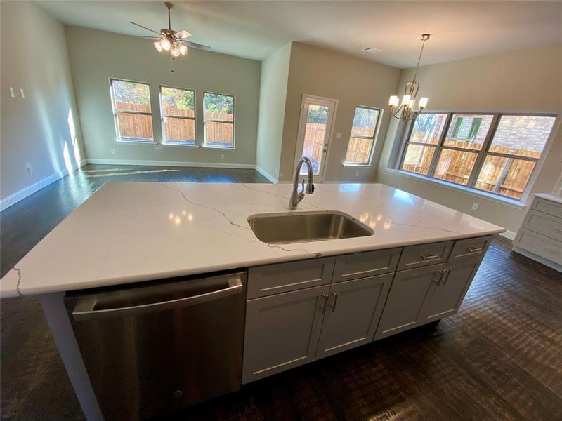 Kitchen featuring grey Shaker cabinetry with Brushed Nickel hardware and soft closing drawers and doors.