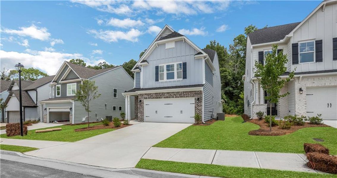 Front exterior of a new home in Villas at Dawsonville, Dawsonville, GA, highlighting curb appeal (Image 2). Front exterior of a new home in Villas at Dawsonville, Dawsonville, GA, highlighting curb appeal (Image 2).
