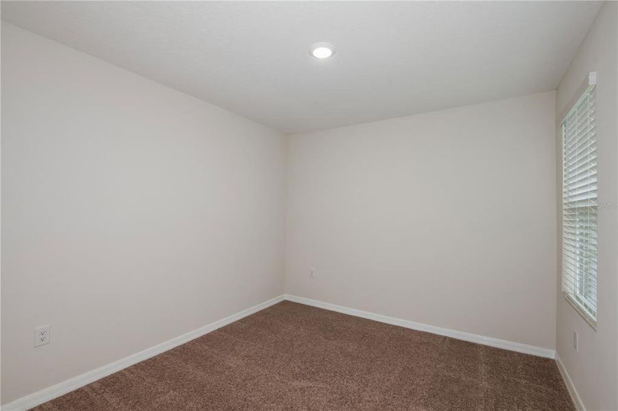 Spacious, unfurnished interior of a new home in Grove at Crosswind, Haines City (Image 22).