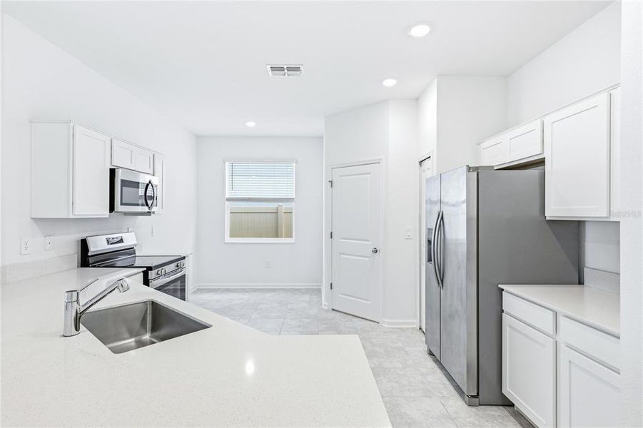 Furnished interior view inside a new home in Peace Creek Reserve, Winter Haven (Image 11).