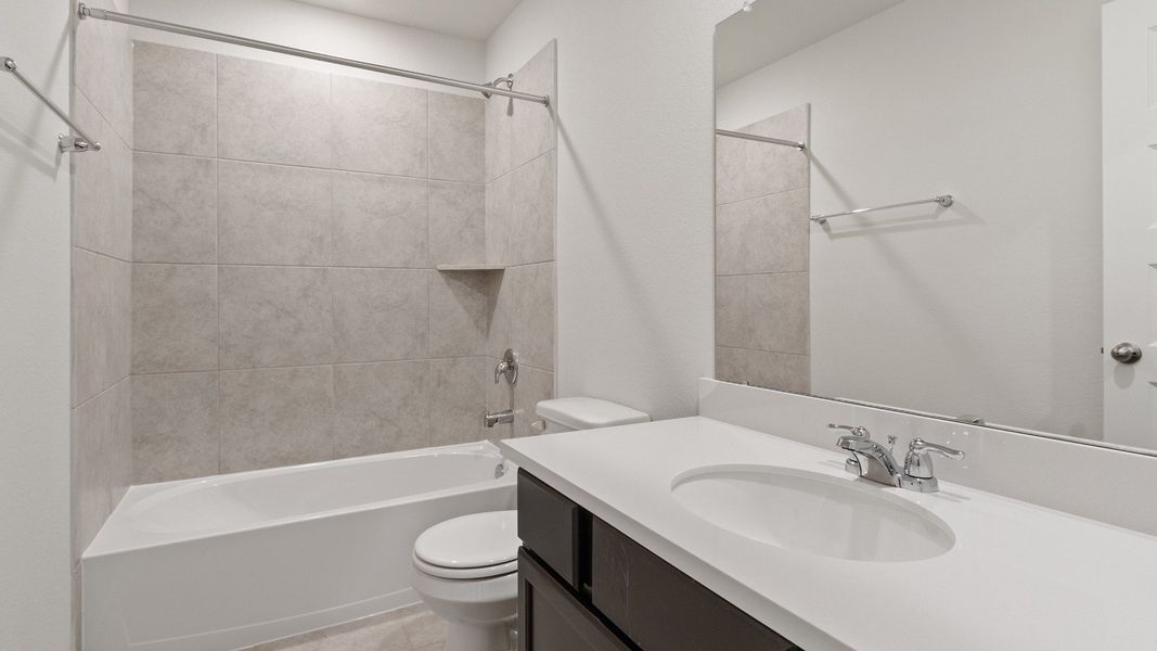 Representative furnished interior of a home built from the Driskill by Brightland Homes in Sunterra, Katy (Image 14).