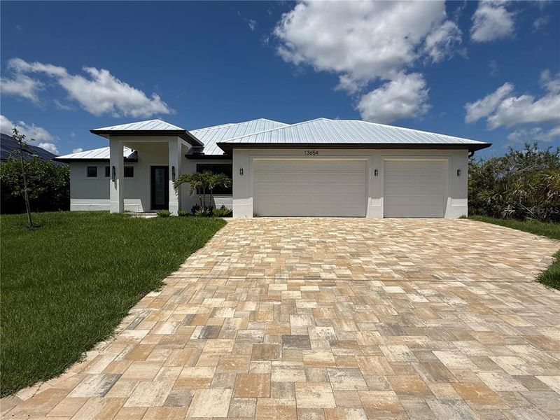 Front exterior of a new home in , Port Charlotte, FL, highlighting curb appeal (Image 2).