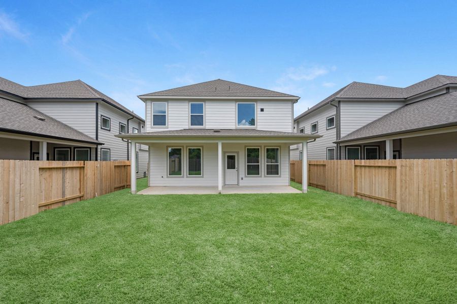Exterior details and patio area of a home in Cypresswood Landing, Humble (Image 4).