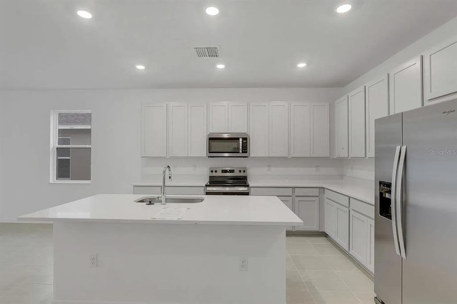 Furnished interior view inside a new home in Cypress Park Estates, Haines City (Image 7).
