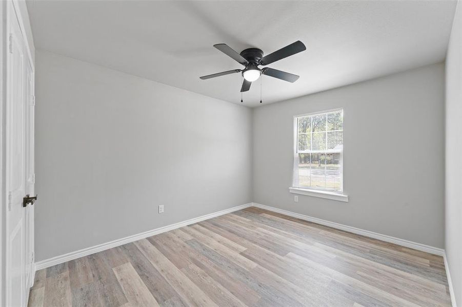 Light gray wall tones with wood-finish flooring Light gray wall tones with wood-finish flooring