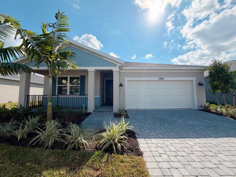 Front exterior of a new home in Brystol at Wylder - Reserve Series, Port St. Lucie, FL, highlighting curb appeal (Image 2).