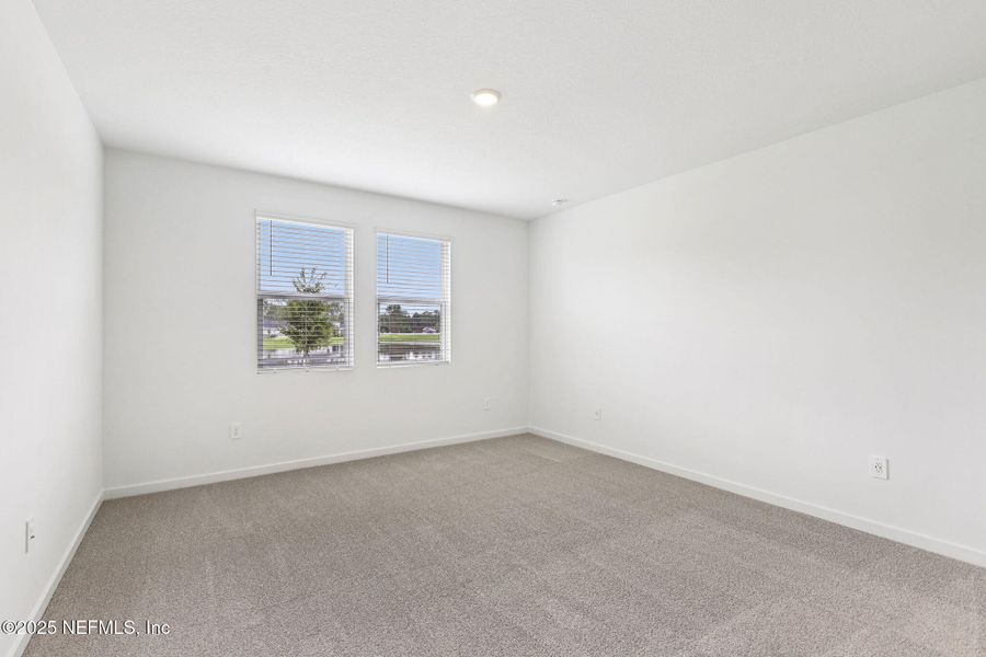 Spacious, unfurnished interior of a new home in Lakes at Bella Lago - Signature Series, Green Cove Springs (Image 21).