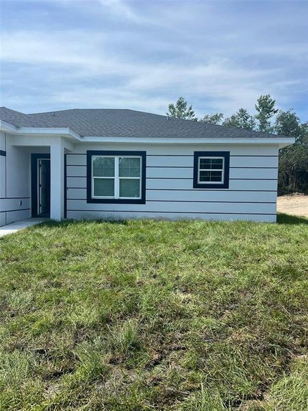 Front exterior of a new home in , Kissimmee, FL, highlighting curb appeal (Image 20).