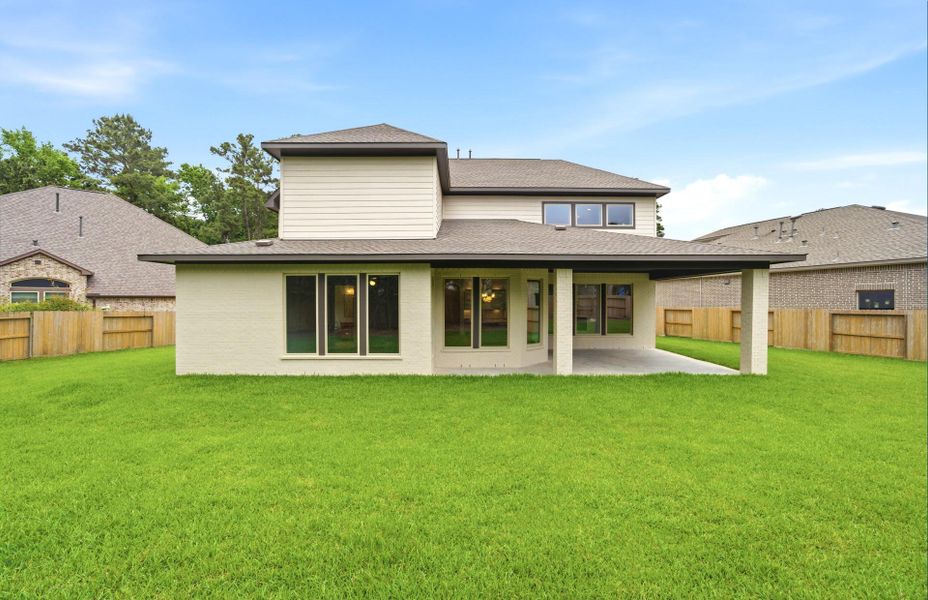 Exterior details and patio area of a home in The Woodlands Hills 65′, Willis (Image 26).