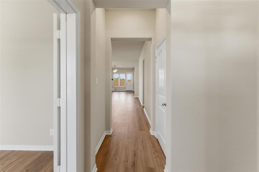 Hall featuring light wood-style flooring