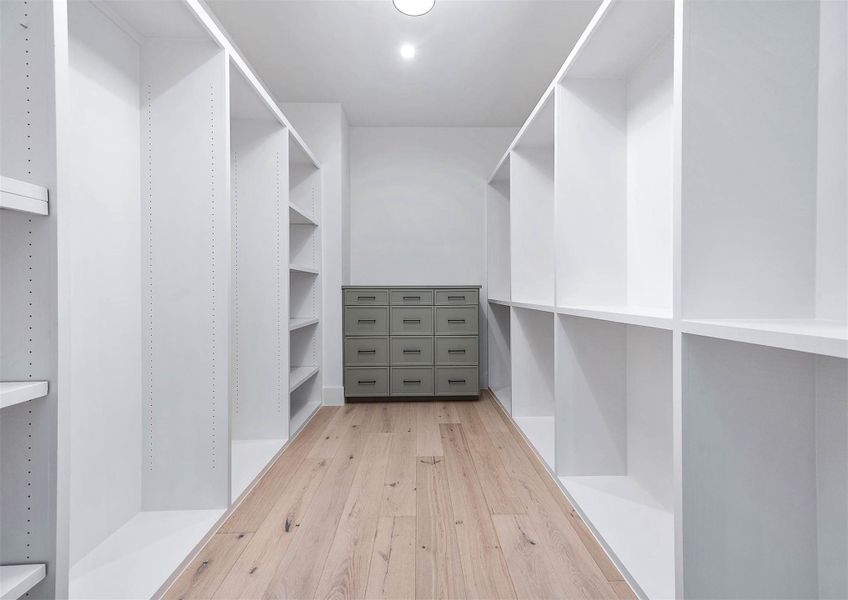 Large custom closets thoughtfully designed throughout the home, offering ample storage and organization space.