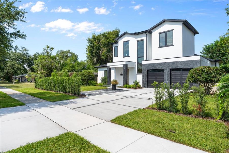 Front exterior of a new home in , Winter Park, FL, highlighting curb appeal (Image 23). Front exterior of a new home in , Winter Park, FL, highlighting curb appeal (Image 23).