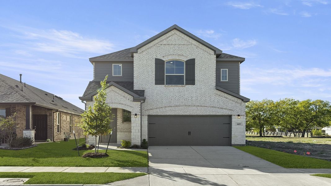 Front exterior of a new home in Elevon 40s, Lavon, TX, highlighting curb appeal (Image 1).