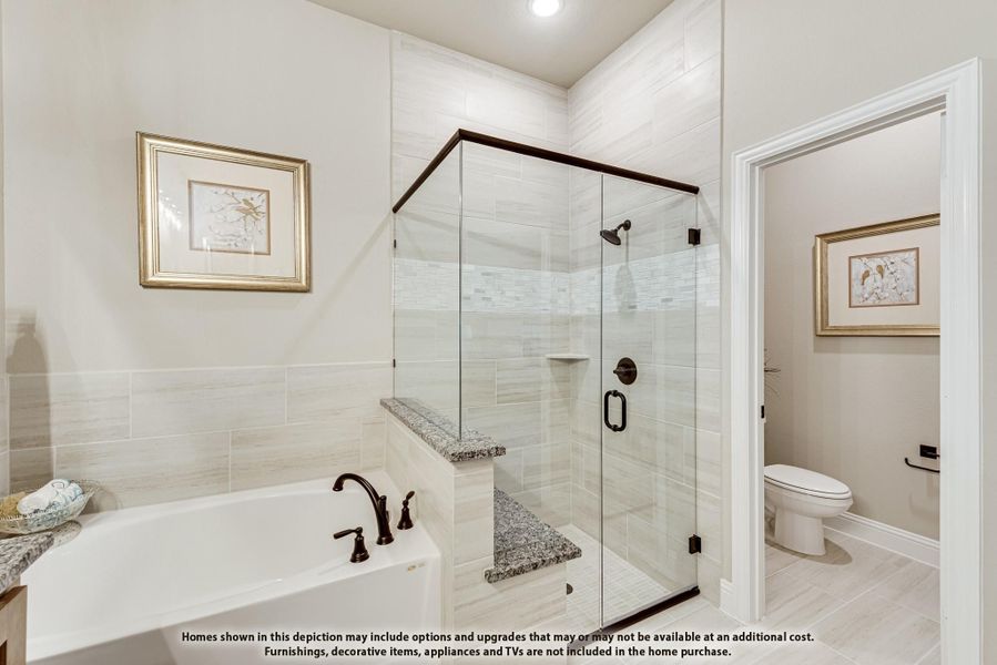 Master bathroom with soaking tub, glass walk-in shower with bench, and separate toilet room Master bathroom with soaking tub, glass walk-in shower with bench, and separate toilet room