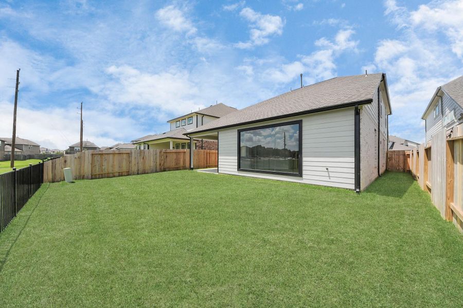 Come and see this spacious backyard with its beautiful covered patio. There is plenty of room for the kids to play and adults to relax. Perfect for your outdoor living space, patio furniture, bbq pit, and so much more. The possibilities are endless! Come and see this spacious backyard with its beautiful covered patio. There is plenty of room for the kids to play and adults to relax. Perfect for your outdoor living space, patio furniture, bbq pit, and so much more. The possibilities are endless!