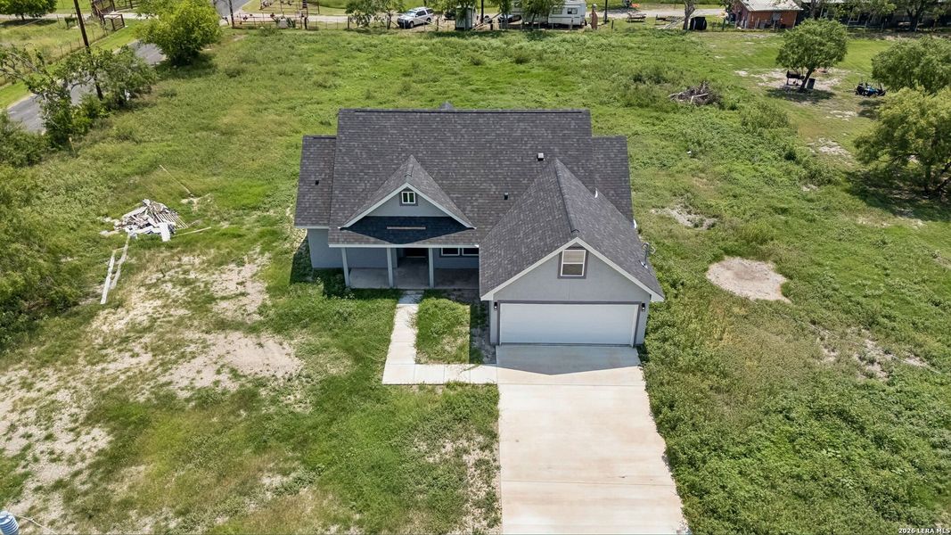 Front exterior of a new home in , Natalia, TX, highlighting curb appeal (Image 22).