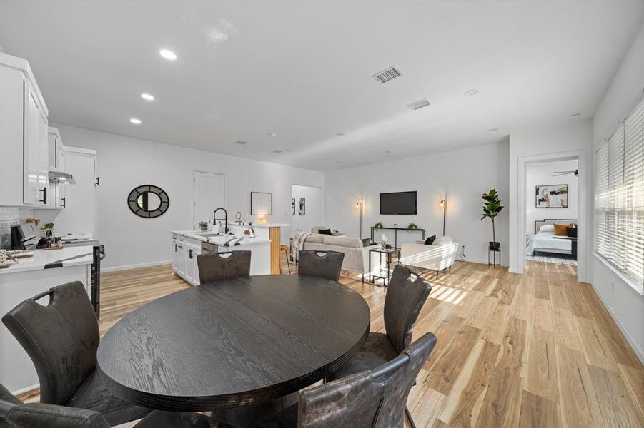 Office space featuring ceiling fan and light hardwood / wood-style flooring