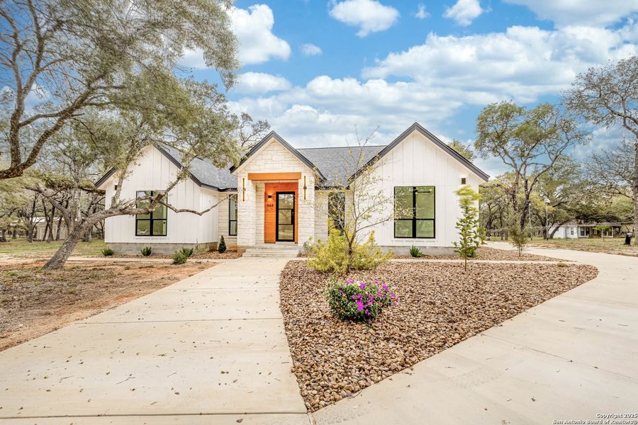 Front exterior of a new home in , Floresville, TX, highlighting curb appeal (Image 1).