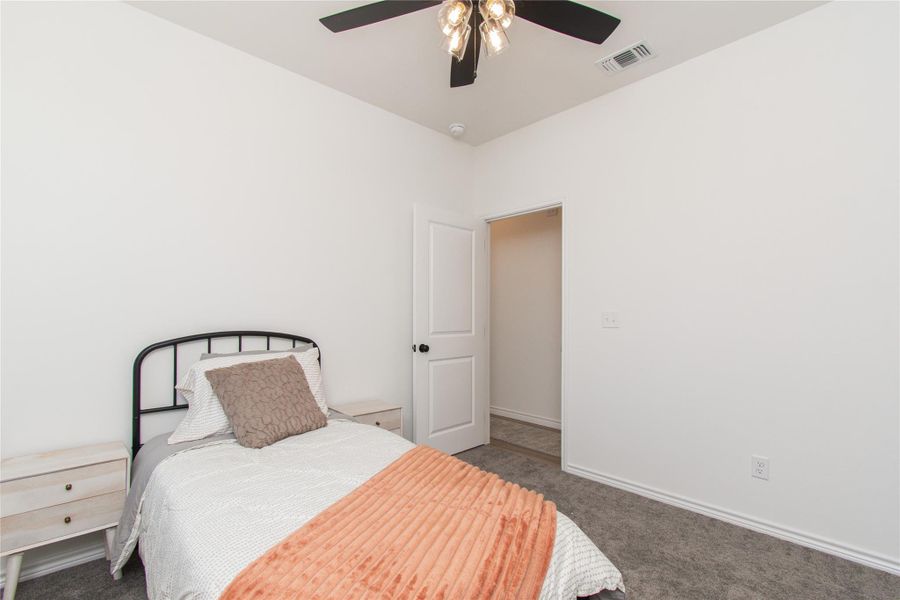 Bedroom with carpet flooring and ceiling fan