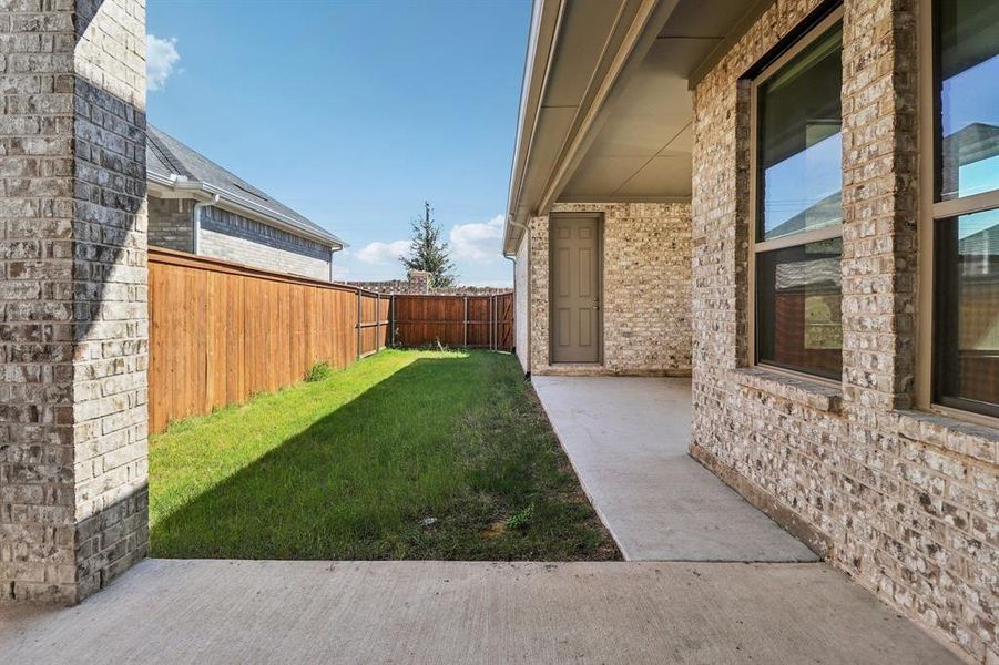 Fenced backyard with a patio Fenced backyard with a patio