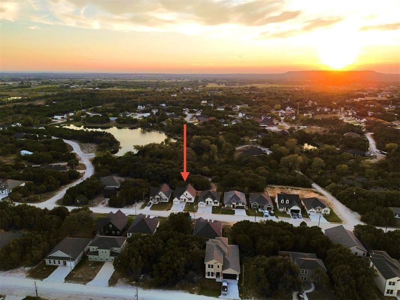 Front exterior of a new home in , Granbury, TX, highlighting curb appeal (Image 1). Front exterior of a new home in , Granbury, TX, highlighting curb appeal (Image 1).