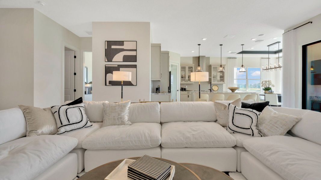 The Living Room of a DRB Homes Grand Eider model, which is a home plan offered at Serengeti in Spring Hill, FL.