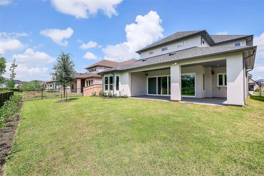 Front exterior of a new home in Sienna 65', Missouri City, TX, highlighting curb appeal (Image 2). Front exterior of a new home in Sienna 65', Missouri City, TX, highlighting curb appeal (Image 2).