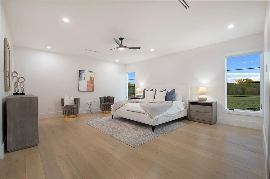 Bedroom featuring light hardwood / wood-style flooring and ceiling fan