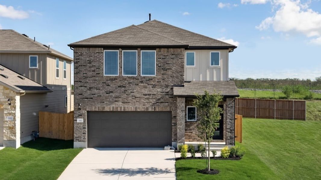 Representative exterior photo of a completed home built from the Merlin by Taylor Morrison in Sunfield, Mustang Ridge, TX (Image 17).