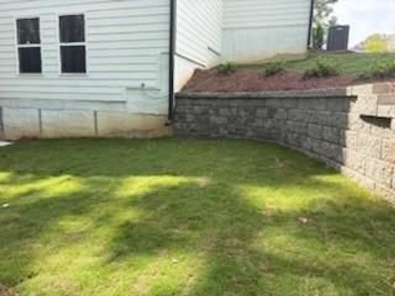 Front exterior of a new home in Riverwood, Dallas, GA, highlighting curb appeal (Image 113). Front exterior of a new home in Riverwood, Dallas, GA, highlighting curb appeal (Image 113).