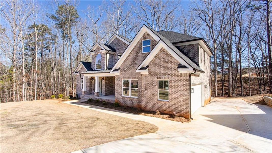 Front exterior of a new home in , McDonough, GA, highlighting curb appeal (Image 25).