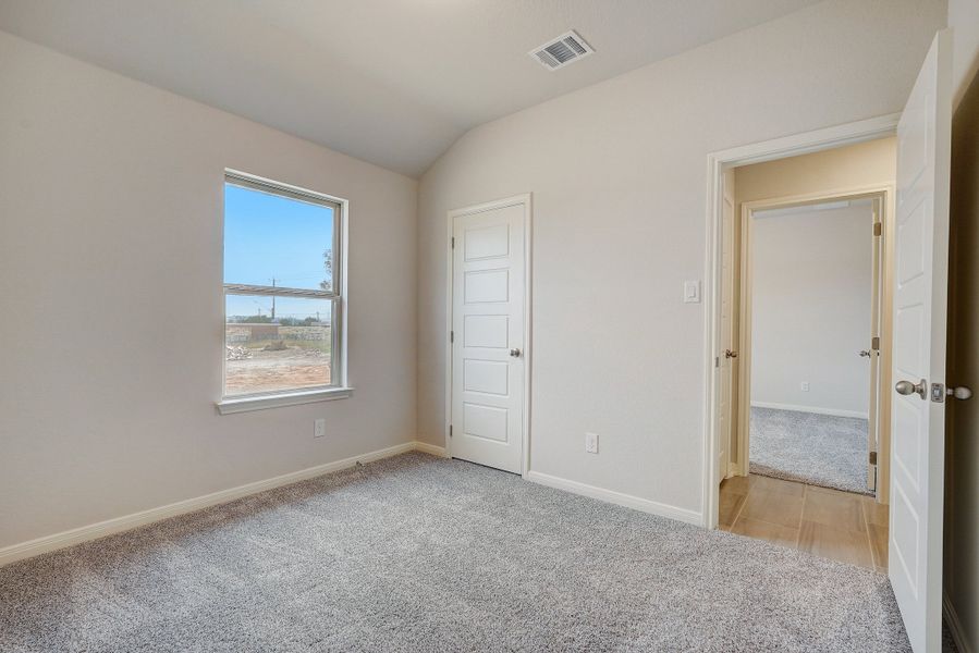 Guest room in the Oleander floorplan at a Meritage Homes community.