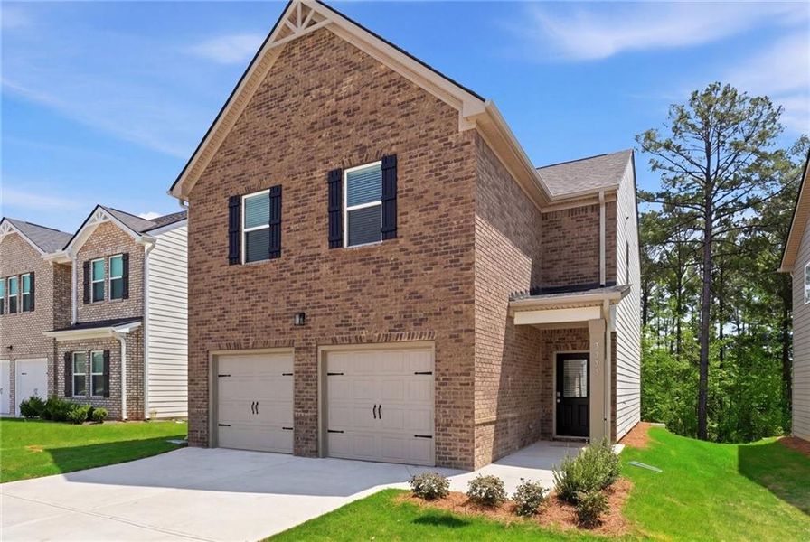Front exterior of a new home in Creekbend Overlook, South Fulton, GA, highlighting curb appeal (Image 14). Front exterior of a new home in Creekbend Overlook, South Fulton, GA, highlighting curb appeal (Image 14).
