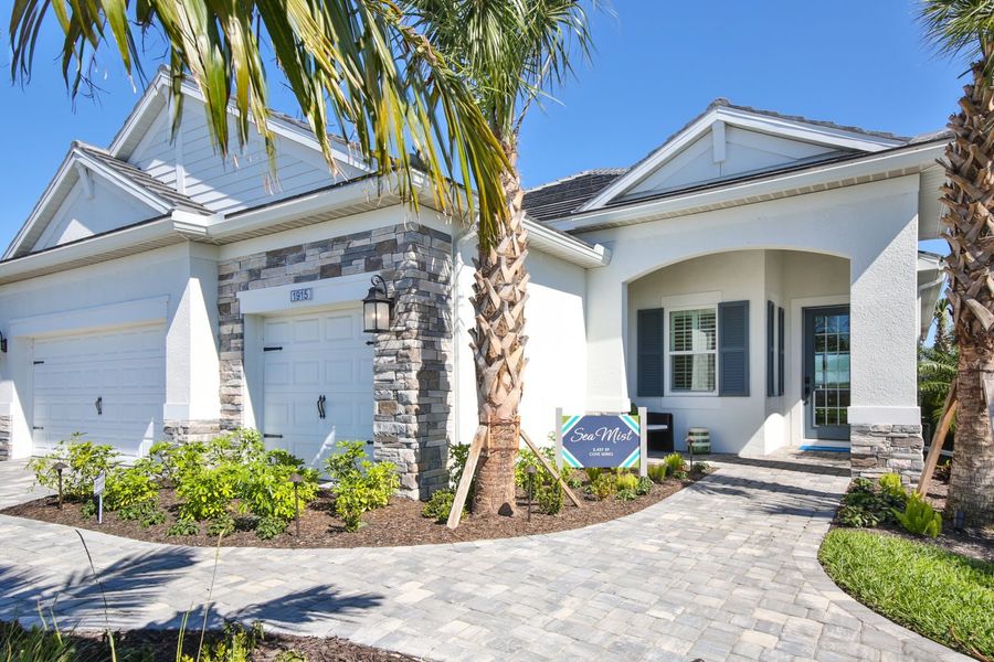 Representative exterior photo of a completed home built from the Sea Mist by Neal Communities in Palm Grove, Bradenton, FL (Image 1). Representative exterior photo of a completed home built from the Sea Mist by Neal Communities in Palm Grove, Bradenton, FL (Image 1).
