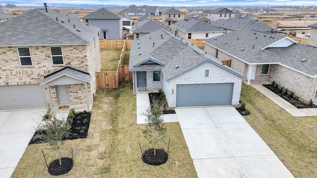 Front exterior of a new home in Anniston, Katy, TX, highlighting curb appeal (Image 21). Front exterior of a new home in Anniston, Katy, TX, highlighting curb appeal (Image 21).