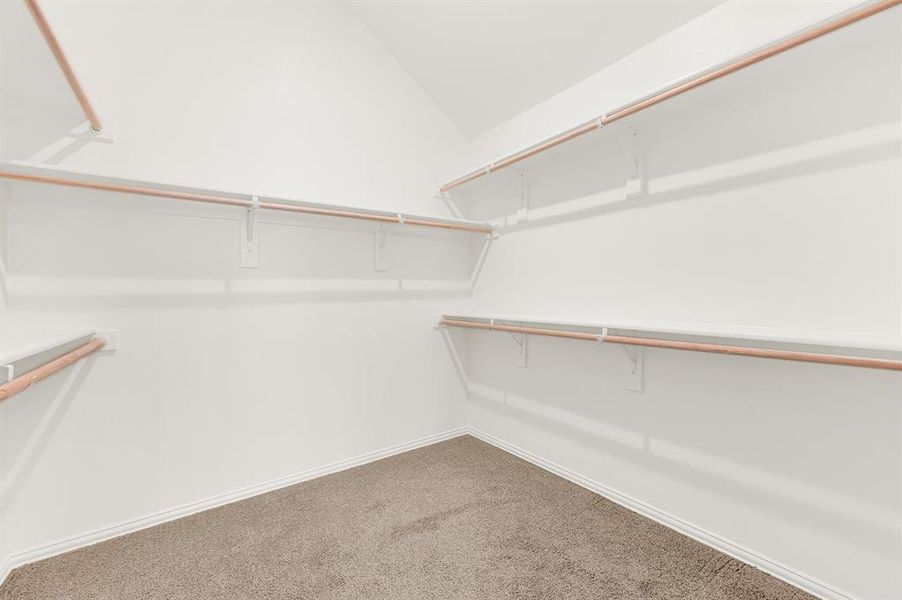 Primary bedroom walk-in closet Primary bedroom walk-in closet