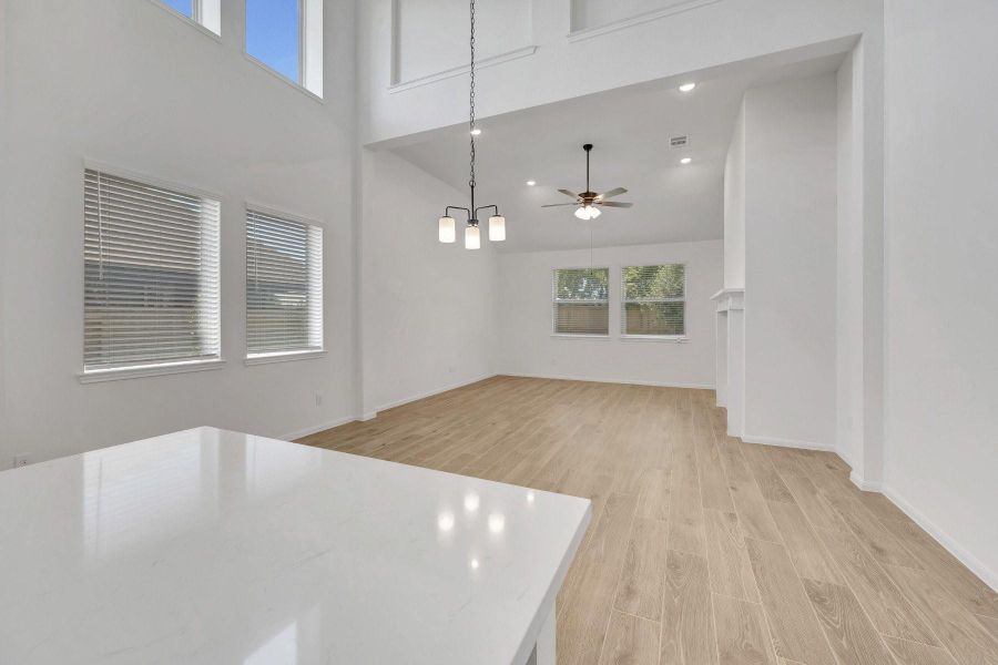 Kitchen open to the dining area and great room (*Photo not of actual home and used for illustration purposes only.)