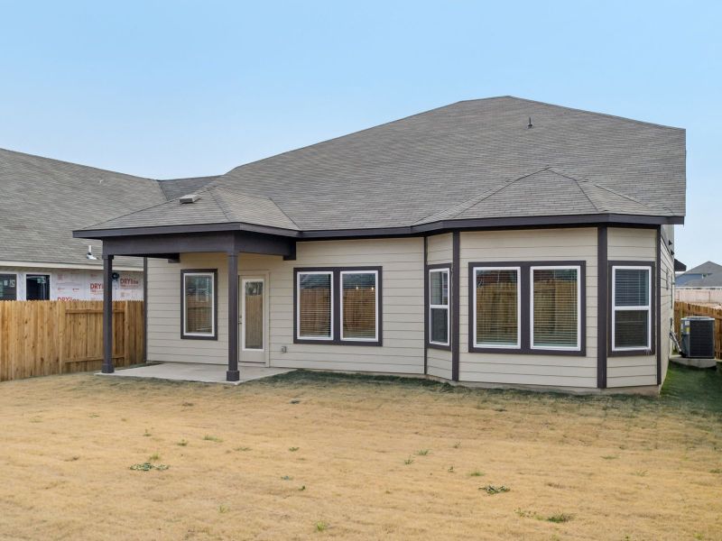Exterior details and patio area of a home in Riverbend at Double Eagle - Boulevard Collection, Cedar Creek (Image 3).