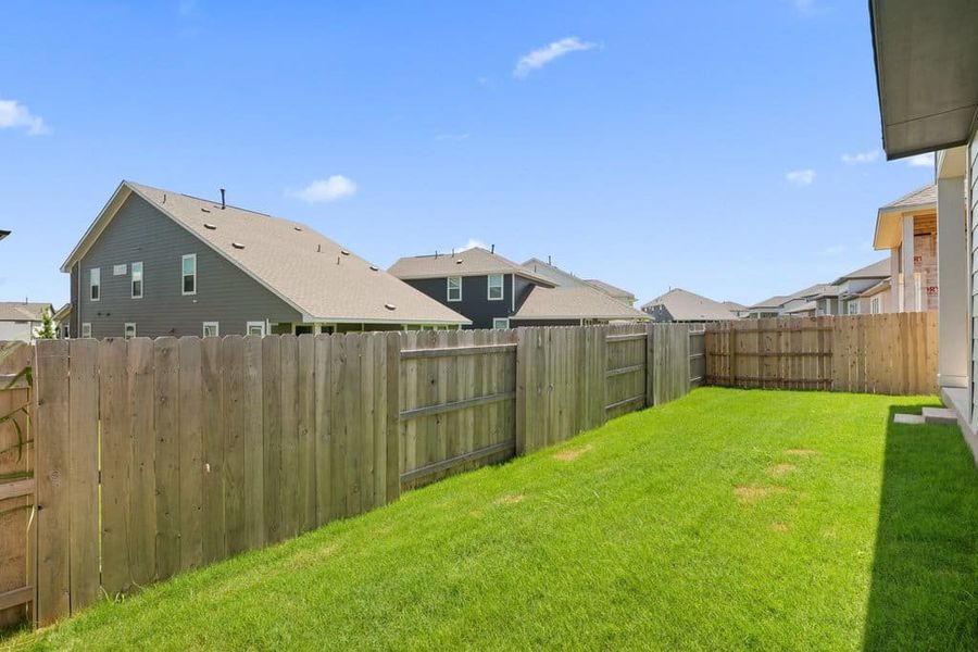 Exterior details and patio area of a home in Lariat, Liberty Hill (Image 27).
