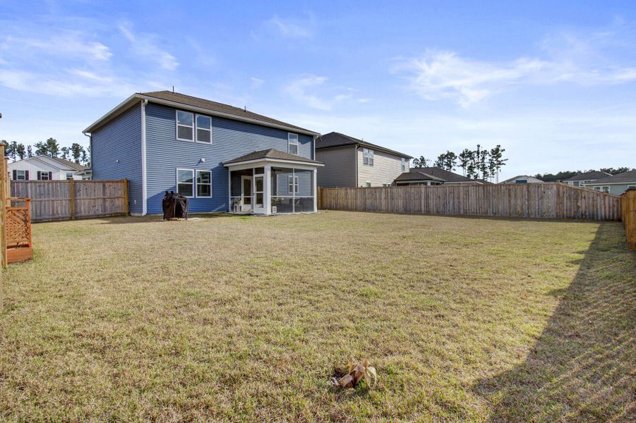 Exterior details and patio area of a home in Sanctuary Cove at Cane Bay, Summerville (Image 25).
