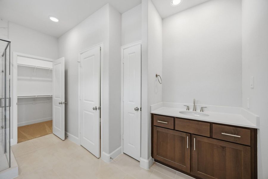 Dual vanities make busy mornings a breeze, ensuring everyone has their own space to get ready.