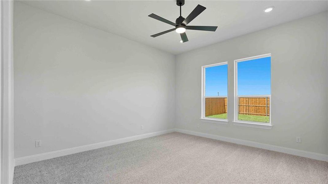 Unfurnished room with light carpet, recessed lighting, and a ceiling fan