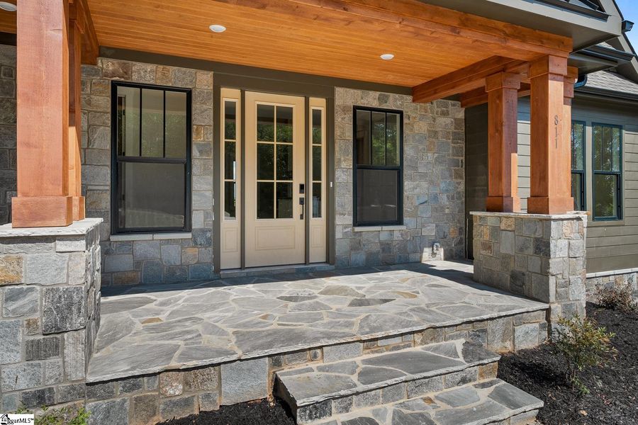 Exterior details and patio area of a home in Greenville County Homes, Landrum (Image 4).