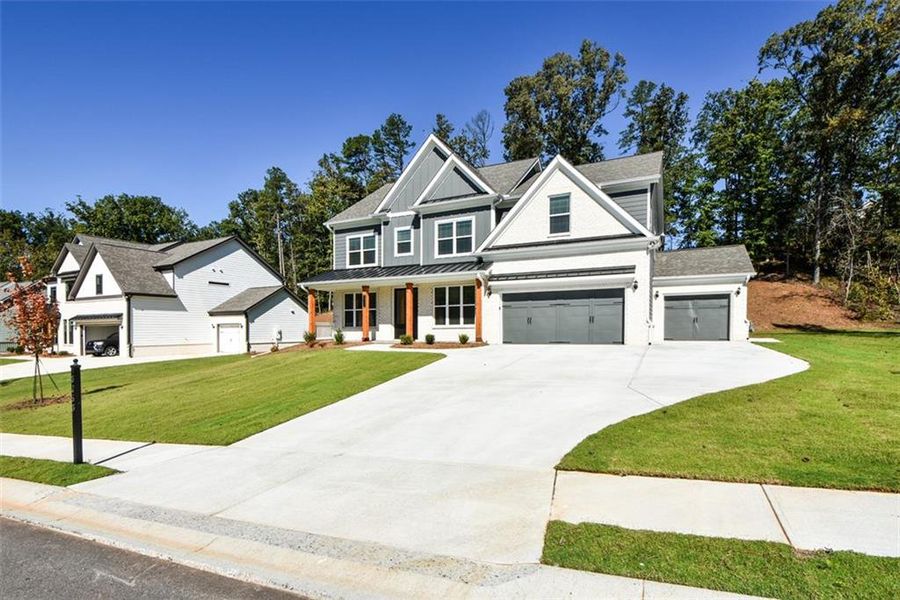 Front exterior of a new home in , Cumming, GA, highlighting curb appeal (Image 25). Front exterior of a new home in , Cumming, GA, highlighting curb appeal (Image 25).