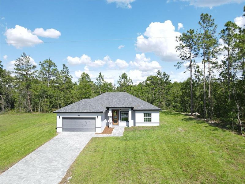 Front exterior of a new home in , Ocala, FL, highlighting curb appeal (Image 2).