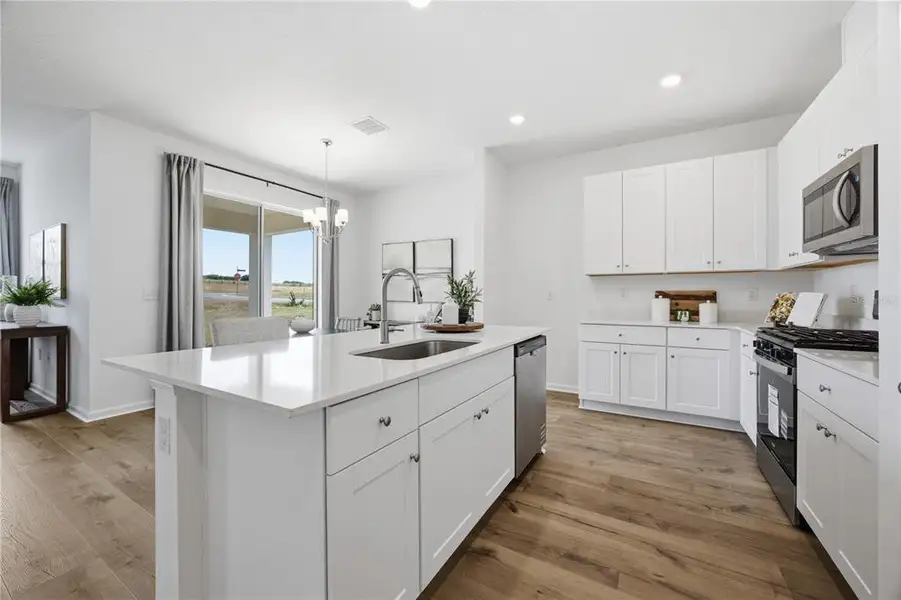 Furnished interior view inside a new home in , Okahumpka (Image 7).