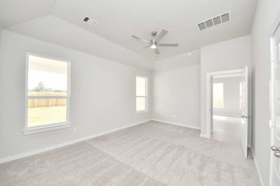 Come and unwind after a long day in this magnificent primary suite! This spacious room features plush carpet, warm paint, high ceilings and large windows with privacy blinds. Come and unwind after a long day in this magnificent primary suite! This spacious room features plush carpet, warm paint, high ceilings and large windows with privacy blinds.