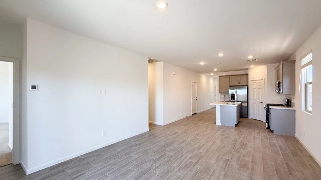 Great room, dining and kitchen Great room, dining and kitchen